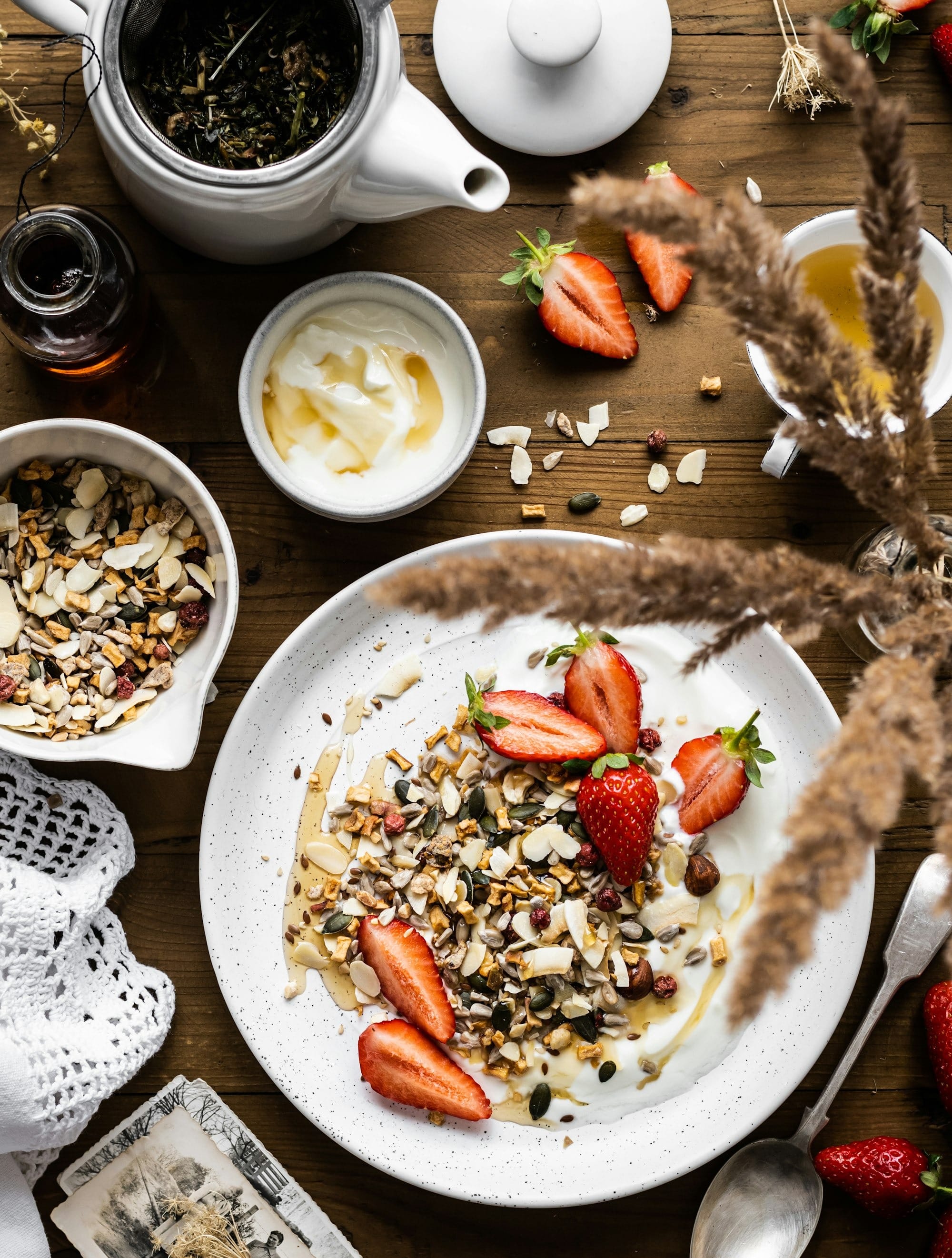 sliced strawberries and nuts on white ceramic plate